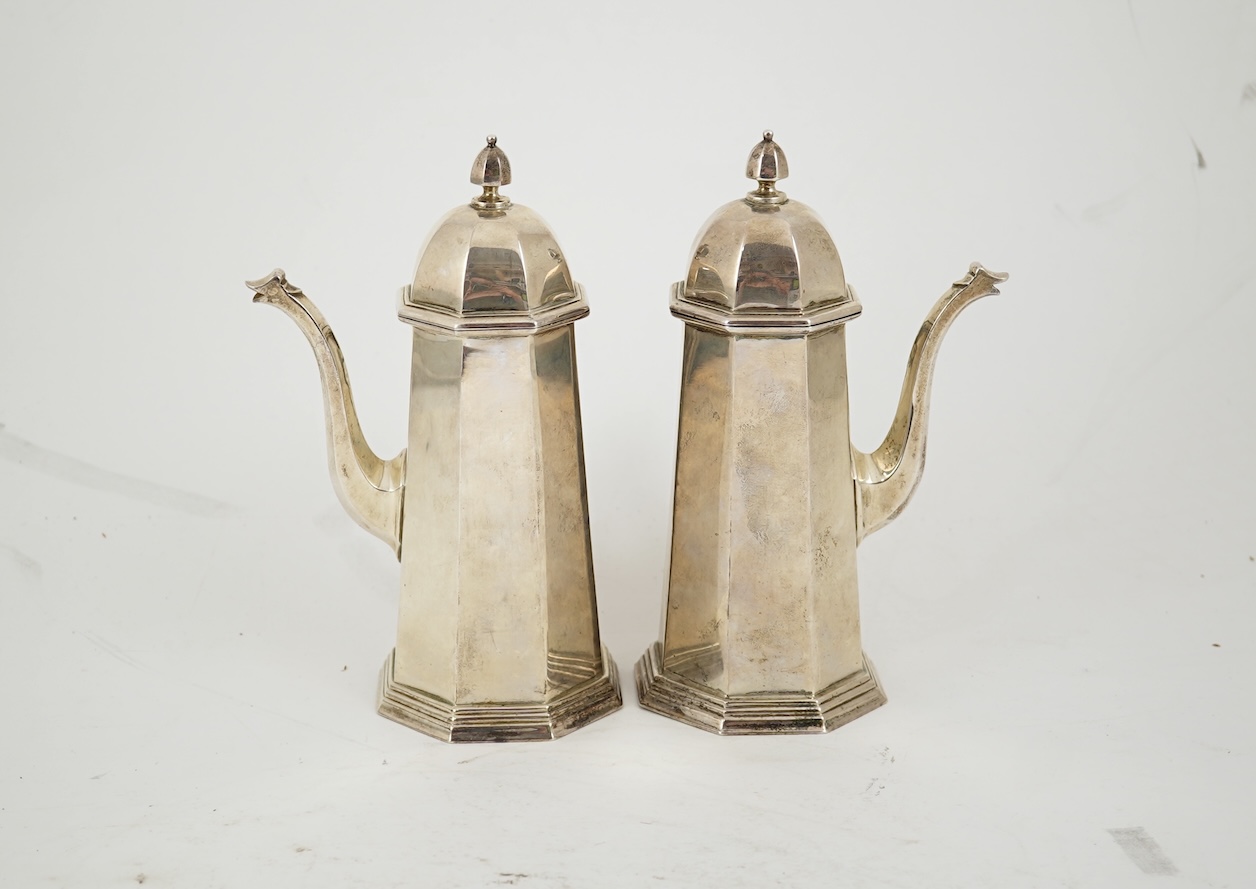 A pair of George V octagonal silver café au lait pots, by William Comyns & Sons Ltd